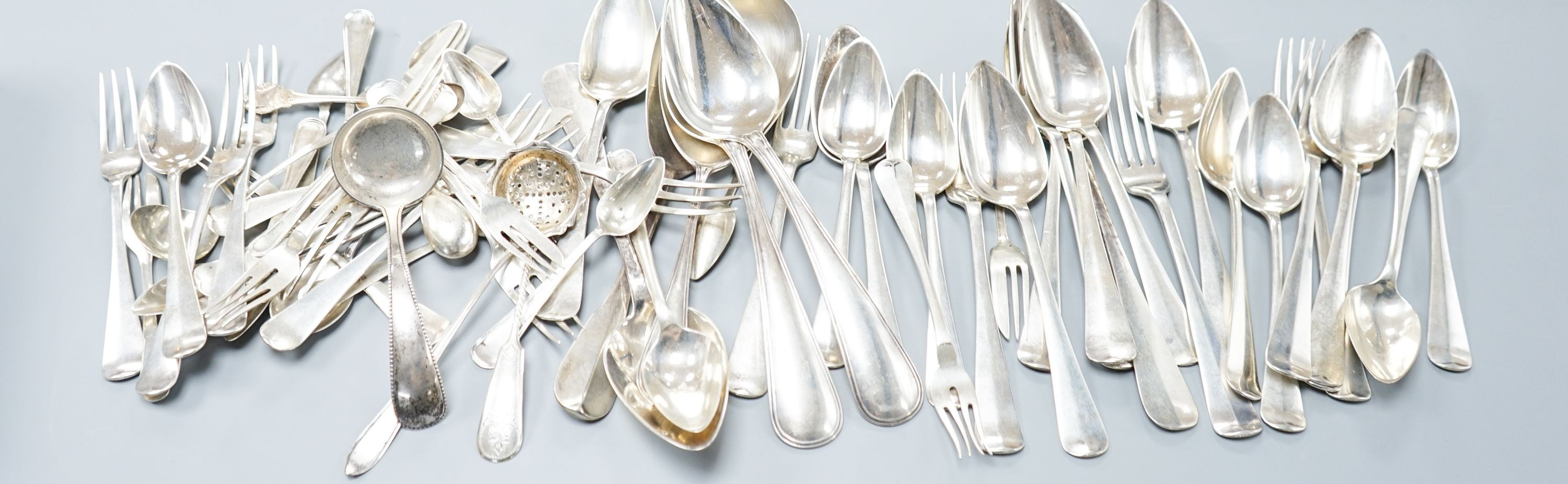A quantity of assorted mainly Dutch white metal flatware including a part canteen, five English silver cake forks and two plated spoons